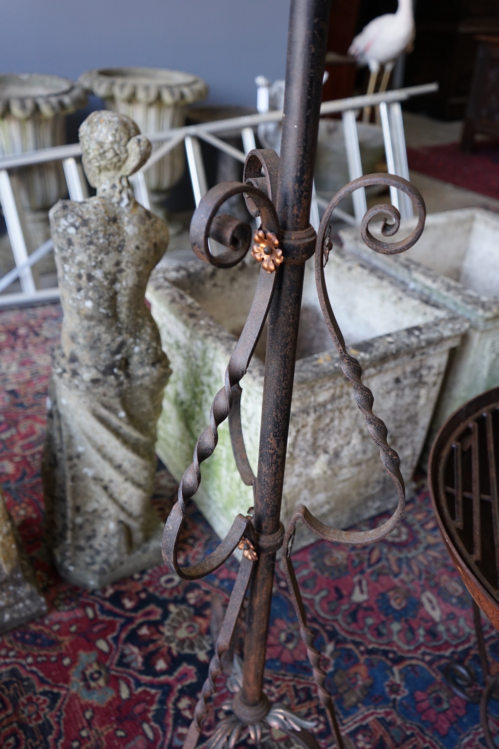 An early 20th century copper mounted wrought iron telescopic oil lamp standard